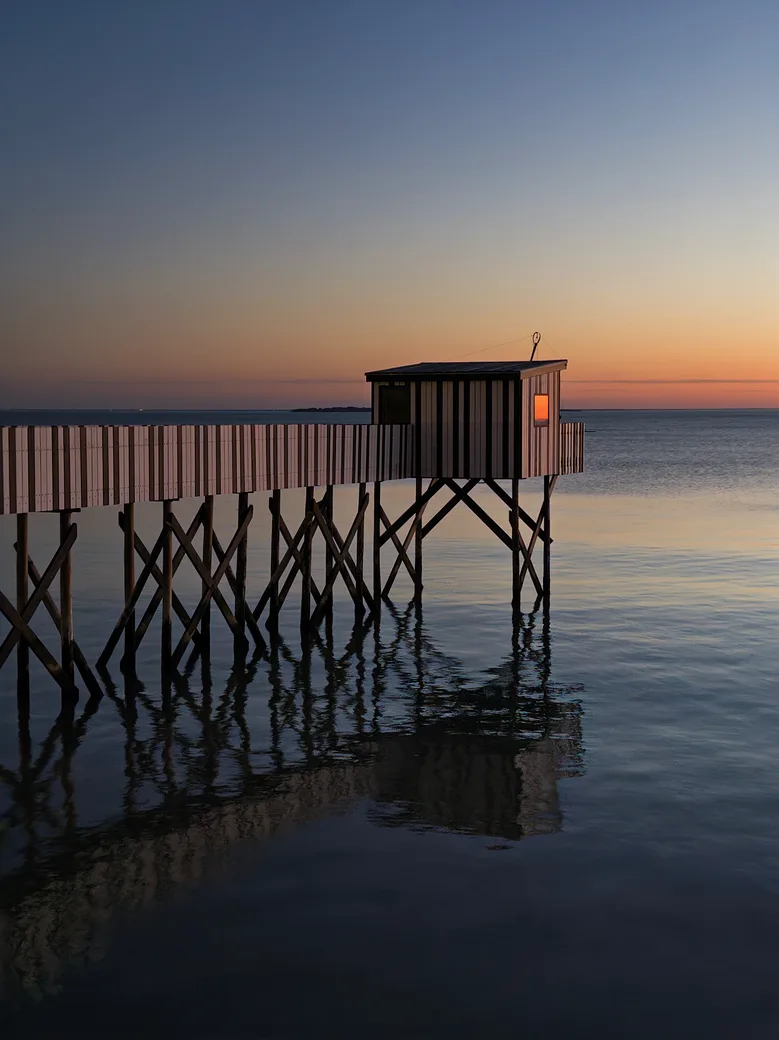 A fishing pier at sunset in La Rochelle, France