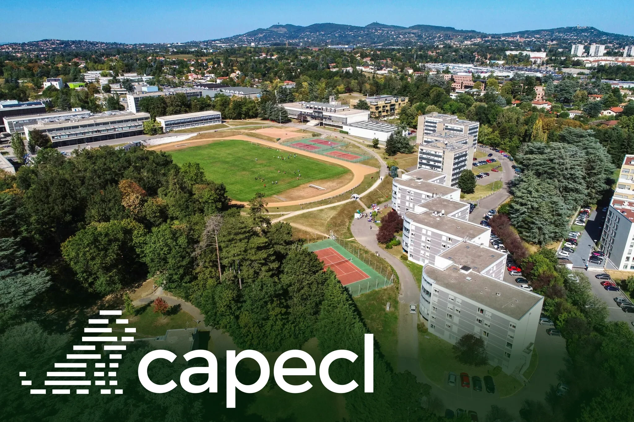 White CapECL symbol and wordmark over a second aerial view of the campus
